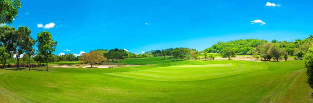 Beautiful green view at golf course ,green trees and mountain blue sky white cloud background