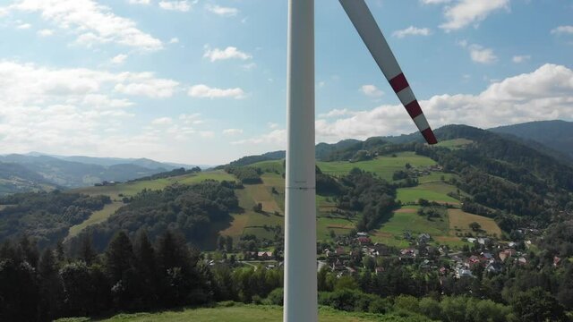 Take off in front of wind turbine