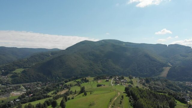Flying over mountain Polom in Beskid Sadecki Mountains near village Rytro, Poland