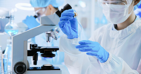 asian scientist take petri dish