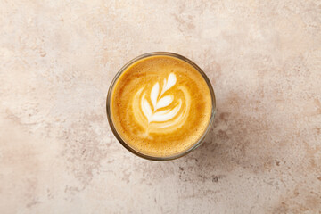 Latte coffee cup with milk on beige vintage pastel background