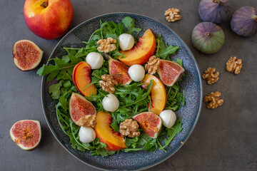 healthy arugula salad with mozzarella cheese and figs 