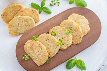 home made cheese crackers with herbs on a table