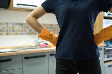woman holding a rag in the kitchen and ready to clean