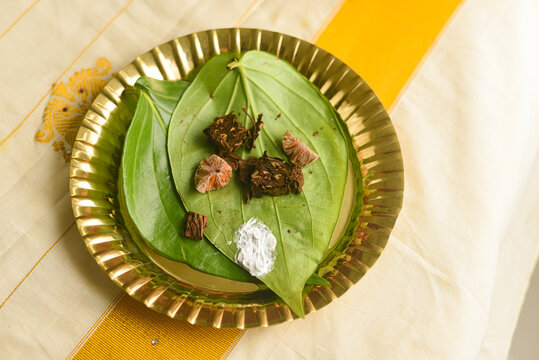 Betel leaf with areca nut paan masala,  Kerala Onam festival giving Dakshina, Indian culture monastery, temple, spiritual guide or after a ritual Pooja. Indian tradition 