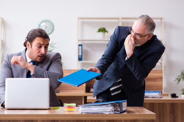 Two employees in pandemic concept at workplace