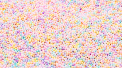 Purple, yellow, blue plastic balls.