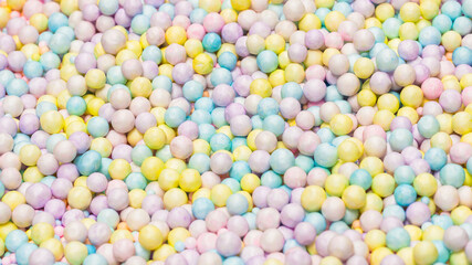 Purple, yellow, blue plastic balls.