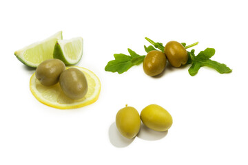 Two olives and piece of lemon and lime isolated on white