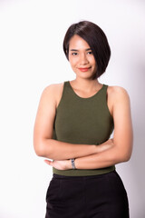 Fototapeta premium Portrait of a smiling asian woman standing with arms folded and looking at camera isolated over white background