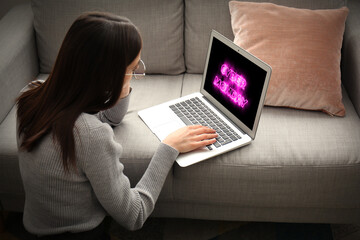 Young woman with laptop at home. Concept of cyber monday
