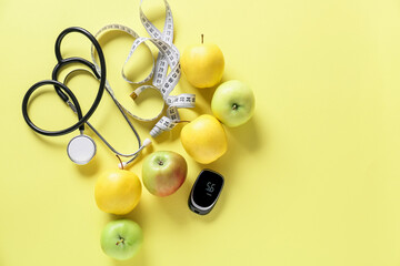 Fruits, measuring tape, stethoscope and glucometer on color background. Diabetes concept