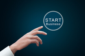 Businessman touching virtual button start