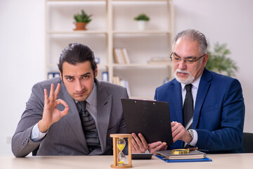 Two businessmen in time management concept