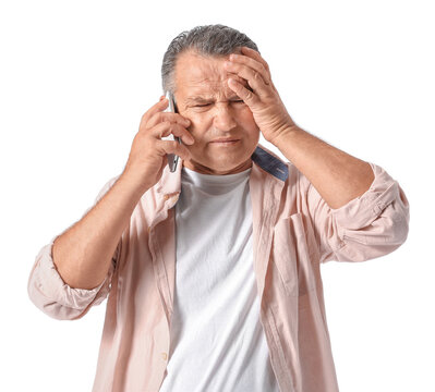 Stressed Mature Man Talking By Phone On White Background