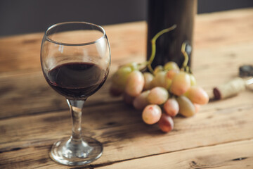 grapes wine bottle and glass with opener