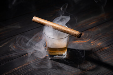 Whiskey and cigar on wooden background close up - Powered by Adobe