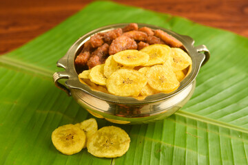 Kerala banana chips for Onam festival popular deep fried snack traditional South Indian tea time snack on banana leaf, Kerala India. fried in coconut oil on Onam, Vishu, Diwali/Deepawali, Ramzan, Eid.