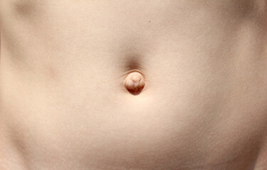 Belly button. the child's stomach. - obrazy, fototapety, plakaty