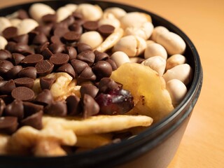 Healthy snack of nuts, chocolate chips, soy beans, banana chips