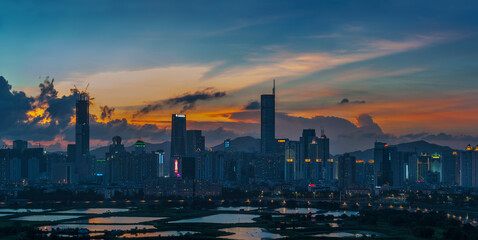 Naklejka premium Skyline of Shenzhen city, China at dusk. Viewed from Hong Kong border