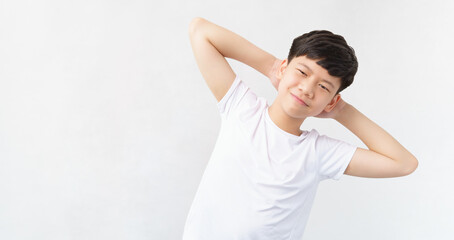 Studio portrait of a good looking, friendly, sporty, fit and healthy asian teenage boy with confident smile. He standing hands behind head and bending his body to his side. Stretching, Good morning.