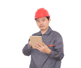 Worker wearing red hard hat holding tablet in hand