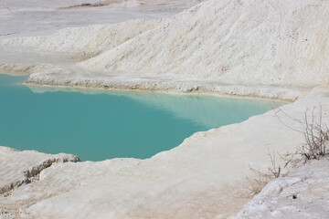 Background from white clay and blue water