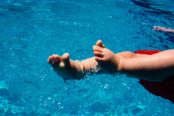 Baby Feet in Swimming Pool Having Fun