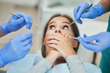 Fototapeta premium Male dentist and woman in dentist office