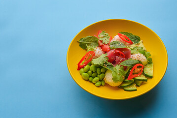 Rice and veggies salad. Delicious healthy vegetable salad with salmon fish. Healthy eating concept, tasty dinner.