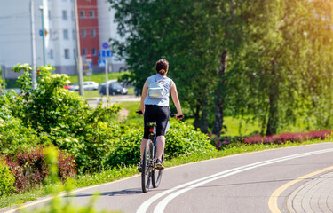 Cyclist ride on the bike path in the city Park