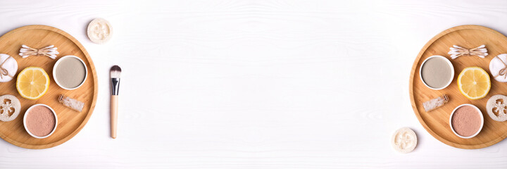 Banner made from cosmetic clay facial masks, sea salt, lemon and brush.