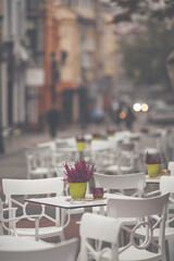 Outdoor street restaurant with tables and chairs