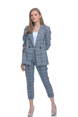 sexy young businesswoman wearing blue checkered suit