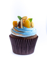 Delicious fresh cupcake with cream of three colors on a white background