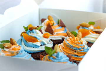 Tricolor cream cupcakes in a white package