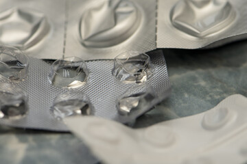 Empty pill boxes on the table, selective focus. Concept: self-medication at home without consulting a doctor, no more medications and painkillers.