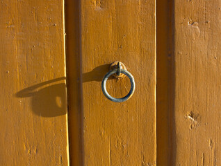 metal ring on wooden wall outdoors