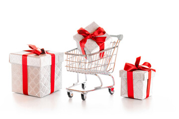Stainless steel cart. Trolley cart for supermarket with christmas or birthday gift box isolated on white background. Sale, discount, shopaholism concept. Consumer society trend.