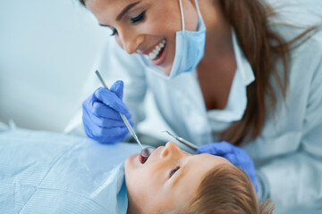 Little boy and female dentist in the dentists office