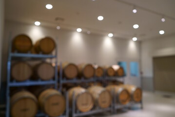 Blurred image of barrels and equipment in a clean wine factory