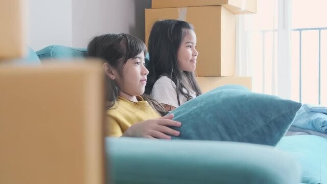 happiness asian child sibling girlfriend playing fun together casual cloth relax leisure weekend activity on sofa couch home