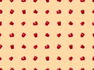 sweet bell pepper pattern. vegetables on a pastel orange background.