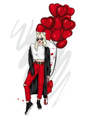 Beautiful girl with long hair wearing glasses, cardigan, pants and sneakers. Heart shaped balloons. Valentine's Day.