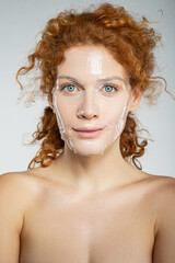 Young beautiful lady with rejuvenation mask on face