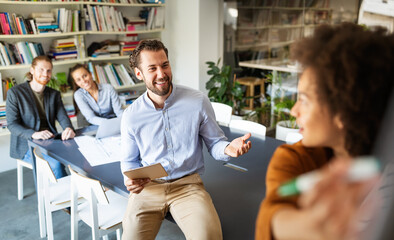 Group of people in a business meeting discussing ideas in office