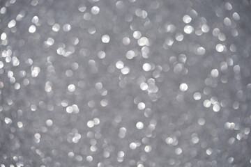 Blurred bokeh of lights of christmas gray garlands