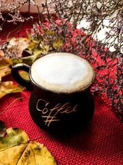 cup of coffee with leaves