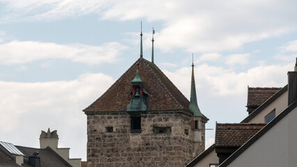 Fototapeta na wymiar Medieval defense tower with embrasure and bell